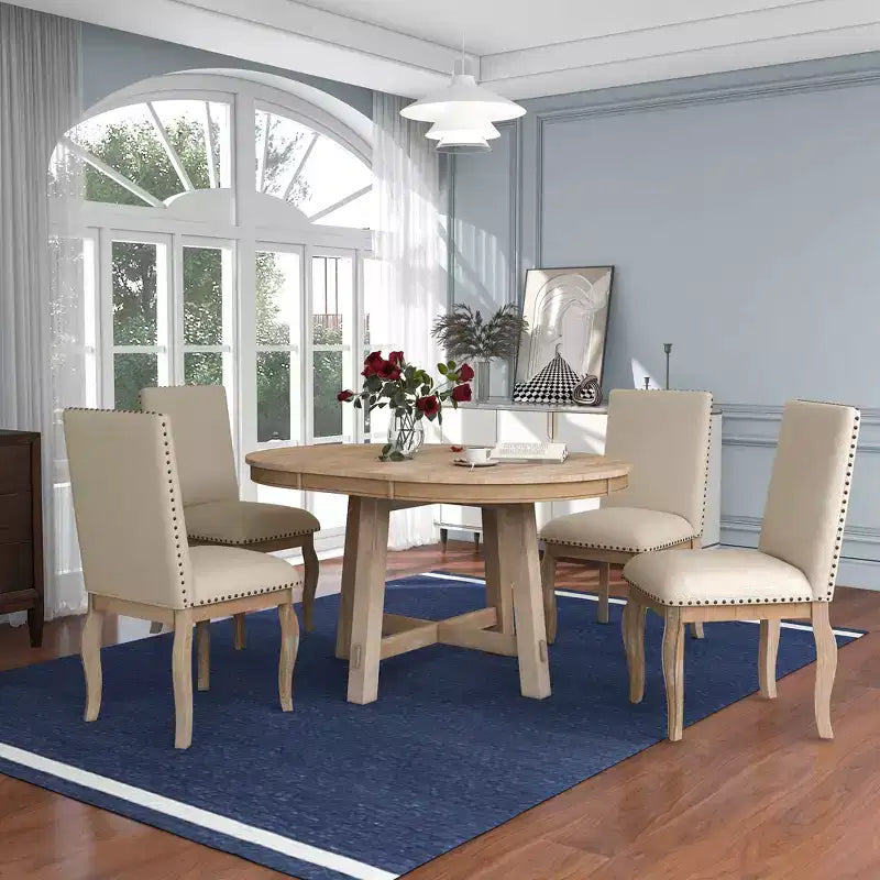 Ensemble de salle à manger 5 pièces Dana de GDFStudio avec table ronde extensible et chaises rembourrées