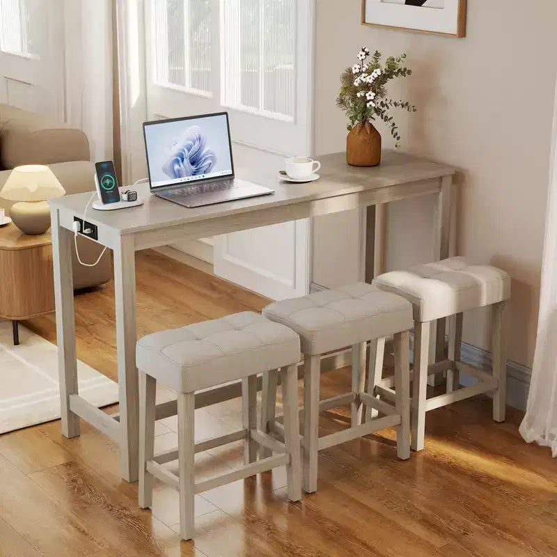 Ensemble de table de bar Costway 4 pièces avec station de recharge et 3 tabourets rembourrés pour salon et cuisine