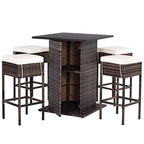 Costway Table de bar 5 pièces en rotin pour terrasse avec tabourets et étagère de rangement cachée, coussinée